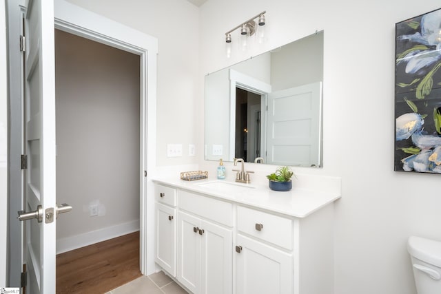 bathroom with tile patterned floors, vanity, and toilet