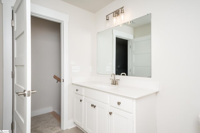 bathroom featuring tile patterned flooring and vanity