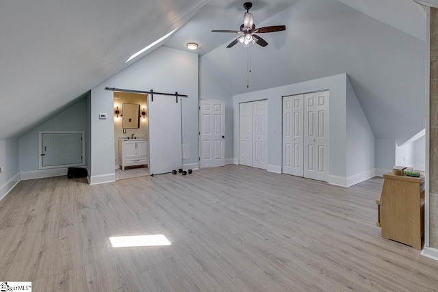 bonus room with ceiling fan, light hardwood / wood-style flooring, and lofted ceiling