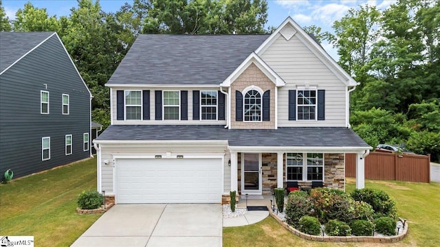 view of front facade with a garage and a front yard