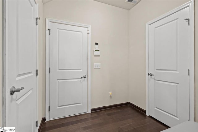 doorway featuring dark wood-type flooring