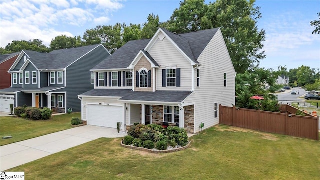 view of front of house with a front lawn and a garage