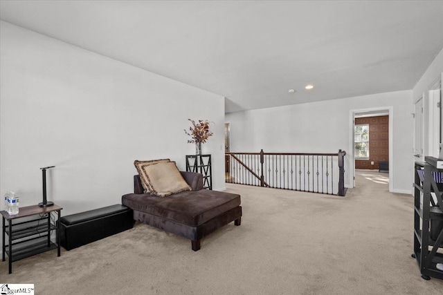 living area featuring light colored carpet