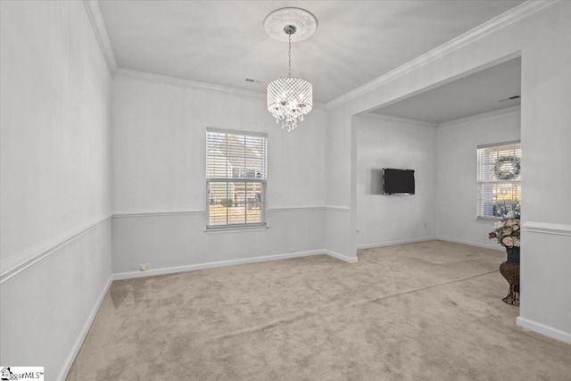 empty room with light carpet, a chandelier, and crown molding