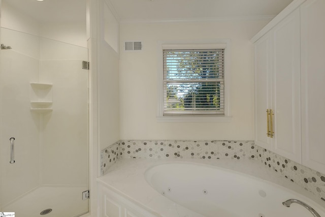 bathroom with shower with separate bathtub and ornamental molding