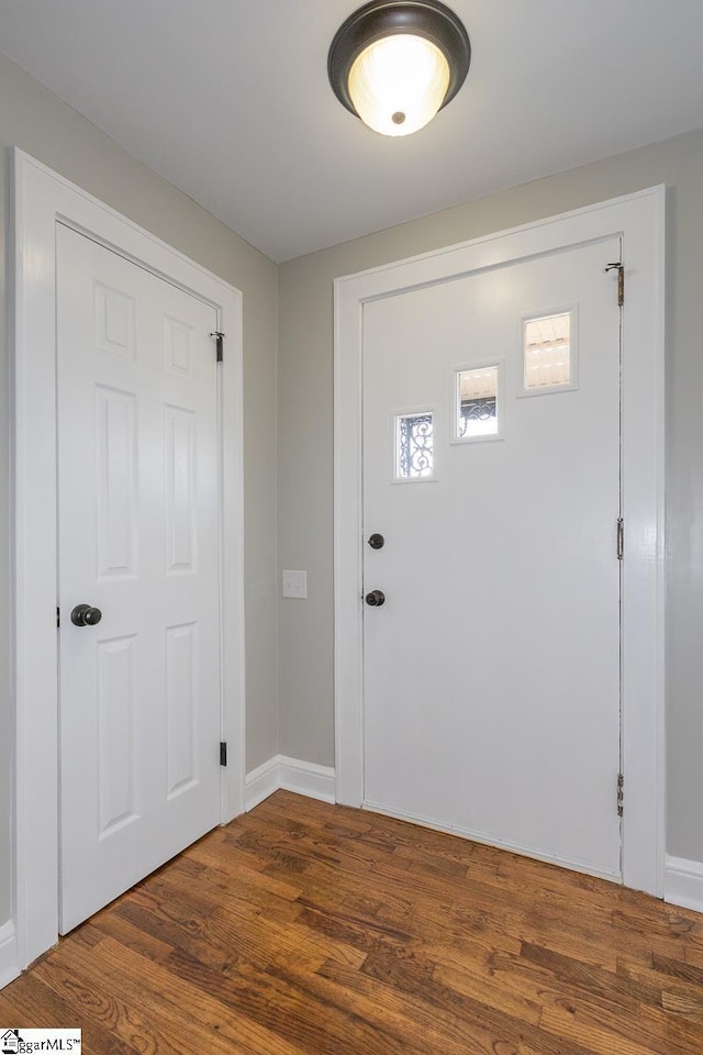 entrance foyer featuring dark hardwood / wood-style floors