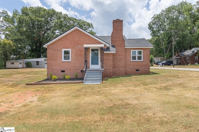 bungalow-style house featuring a front yard