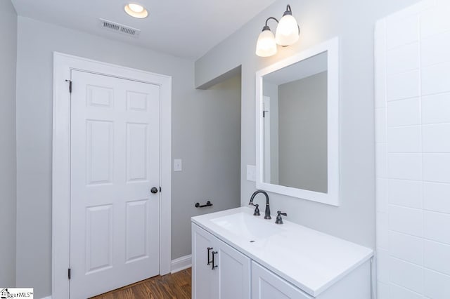 bathroom featuring vanity and hardwood / wood-style flooring