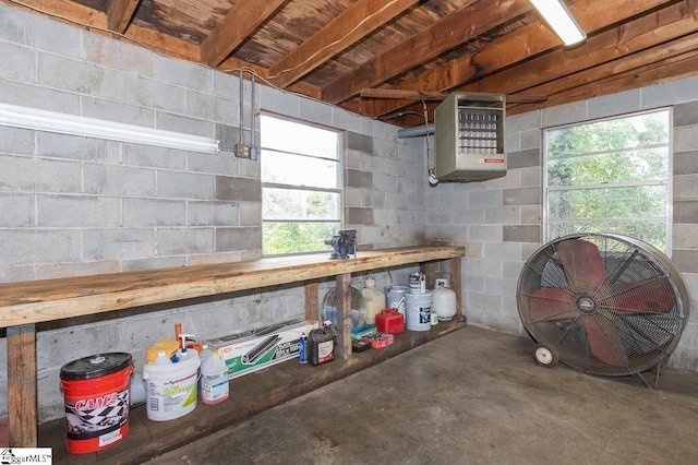 basement with heating unit and a wealth of natural light