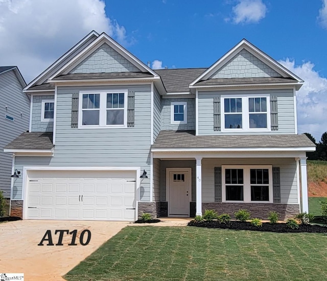 craftsman-style house with a front yard and a garage