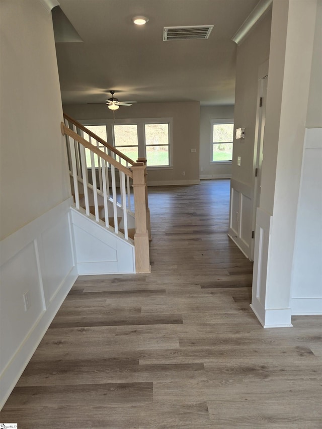 corridor with wood-type flooring