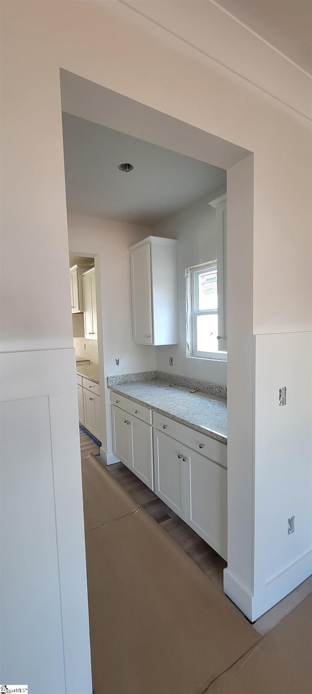 kitchen featuring white cabinets