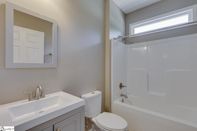 full bathroom with vanity, toilet, and  shower combination