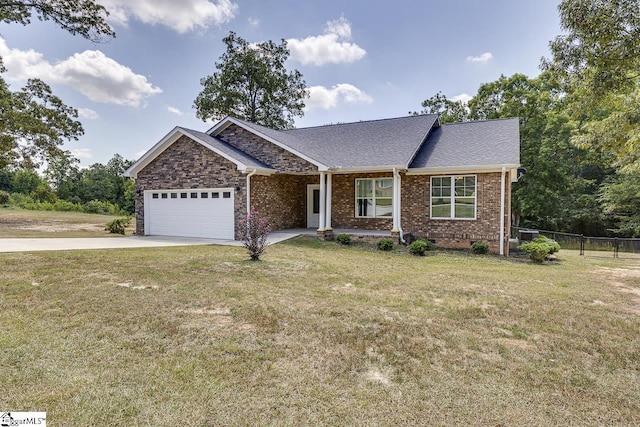 view of front of home featuring a garage and a front yard