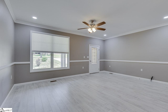 empty room featuring crown molding, ceiling fan, and light hardwood / wood-style floors