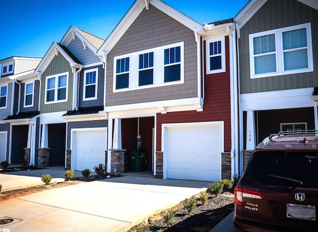 multi unit property featuring a garage