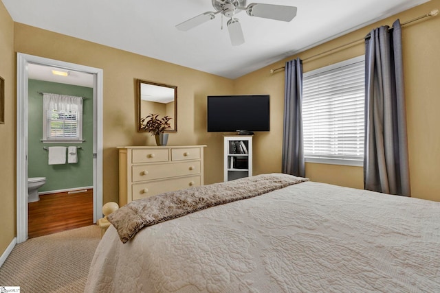 bedroom featuring ceiling fan and ensuite bathroom