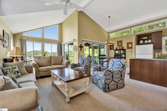 living room with ceiling fan, high vaulted ceiling, and carpet floors