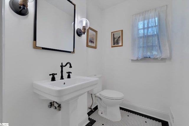 bathroom with tile patterned floors and toilet