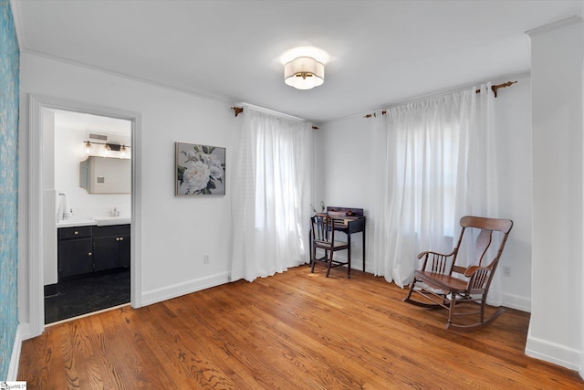 sitting room featuring hardwood / wood-style flooring