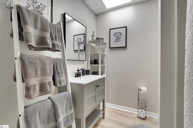 bathroom with vanity and wood-type flooring