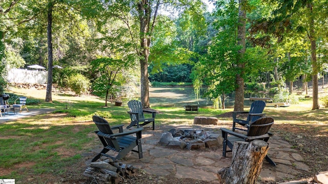 view of patio with a fire pit