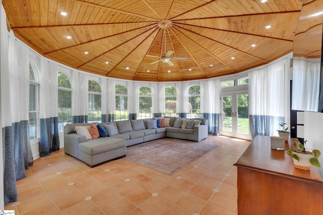 sunroom featuring ceiling fan, french doors, and wooden ceiling