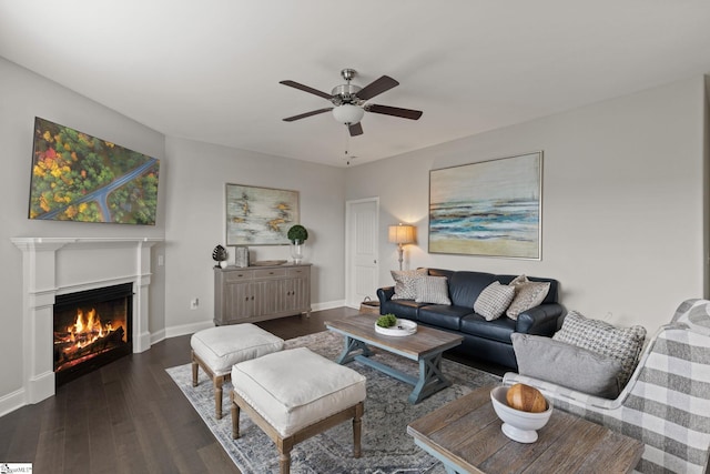 living room featuring dark hardwood / wood-style floors and ceiling fan