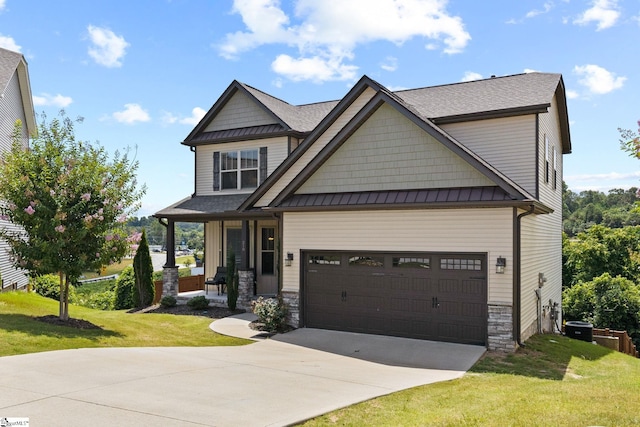 craftsman-style home featuring a front lawn and a garage