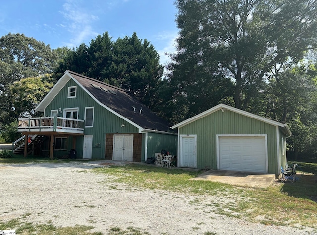 419 Wood Rd, Taylors, SC 29687 - view of front facade with a garage, a wooden deck, and an outdoor structure