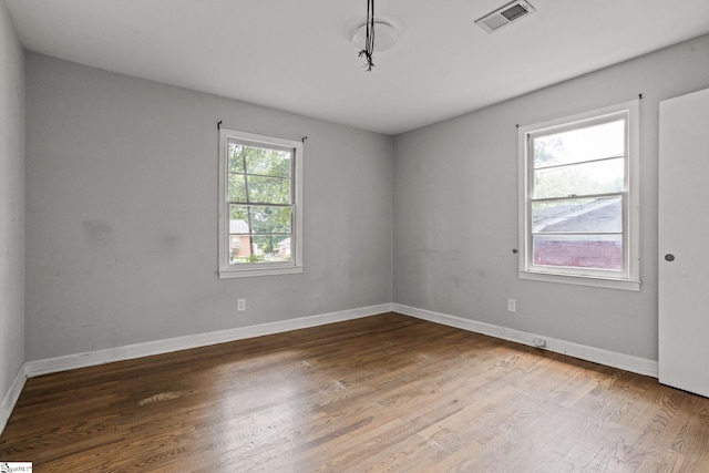 empty room featuring hardwood / wood-style floors