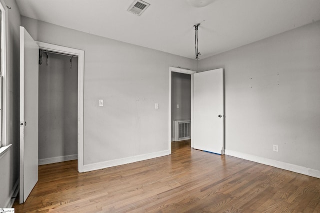 unfurnished bedroom featuring light wood-type flooring