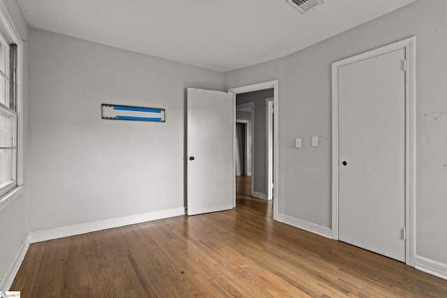 unfurnished bedroom featuring hardwood / wood-style floors