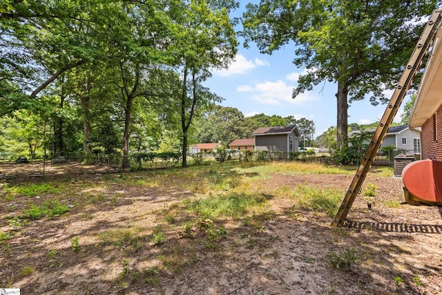 view of yard with central AC