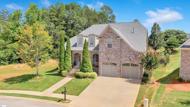 view of front of home with a garage and a front yard