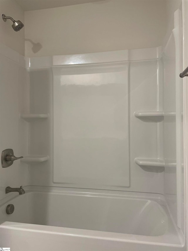 bathroom featuring  shower combination