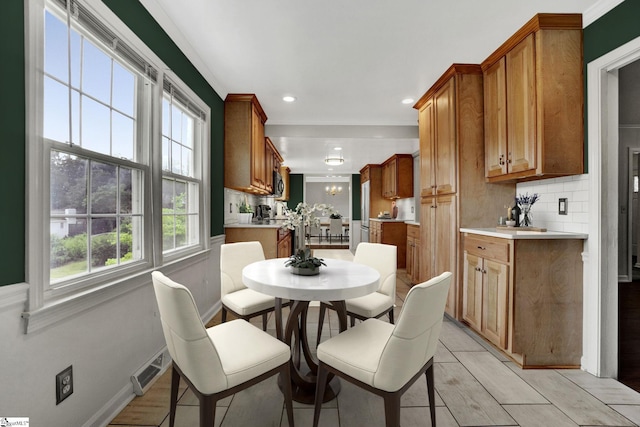 dining area featuring an inviting chandelier, baseboards, visible vents, and recessed lighting