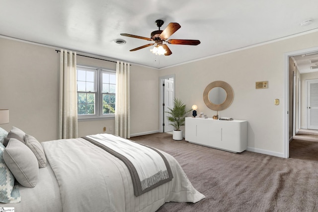 carpeted bedroom with ornamental molding and ceiling fan