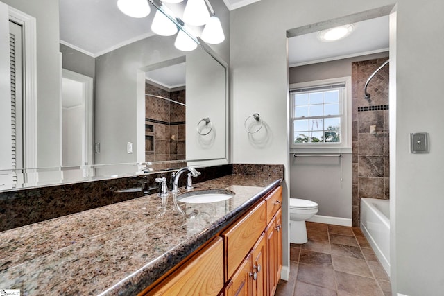 bathroom featuring baseboards, toilet, bathtub / shower combination, crown molding, and vanity