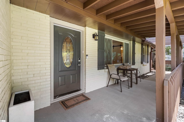 doorway to property with covered porch