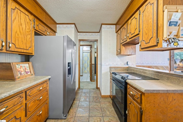 kitchen featuring a textured ceiling, stainless steel fridge, black range with electric cooktop, and ornamental molding