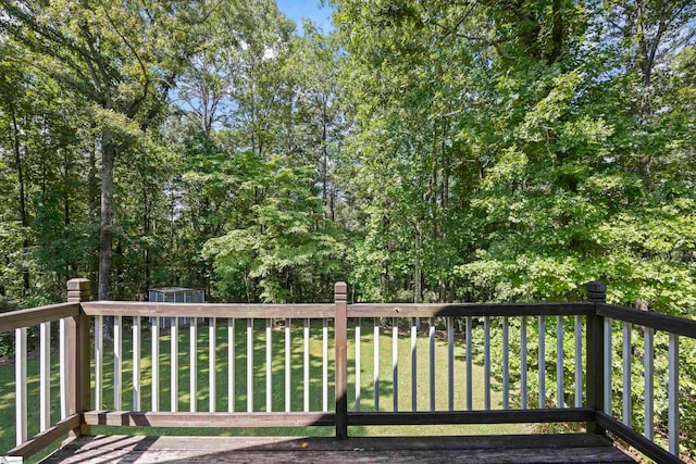 deck featuring a lawn