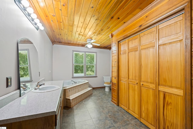 bathroom with toilet, wood ceiling, a relaxing tiled tub, ornamental molding, and vanity