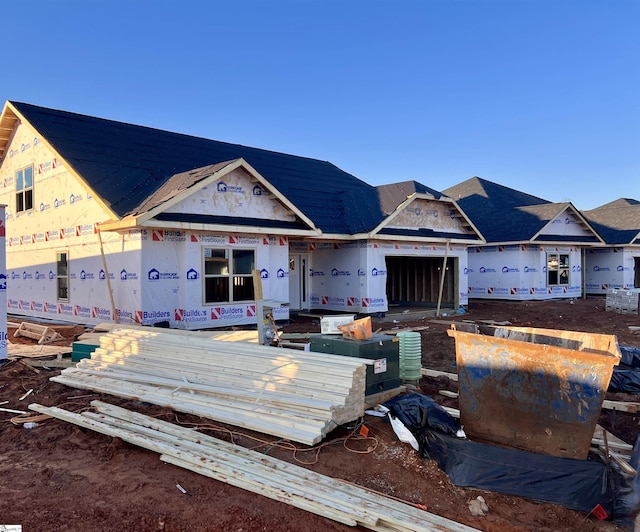 unfinished property featuring an attached garage