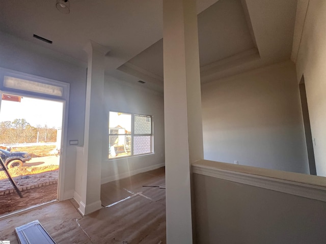 doorway featuring baseboards