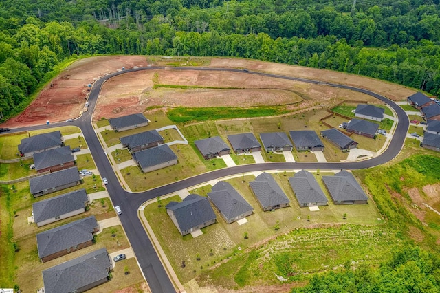 aerial view featuring a residential view and a view of trees