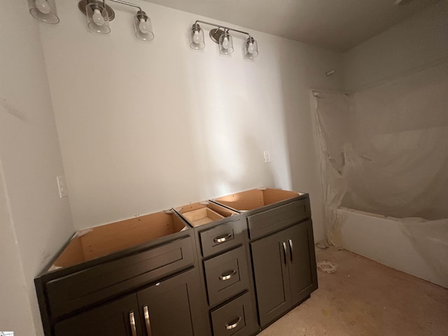 bathroom with unfinished concrete flooring and bathtub / shower combination