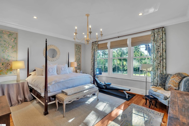 bedroom featuring crown molding, a notable chandelier, and hardwood / wood-style floors