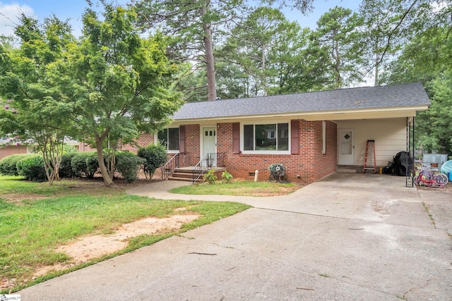 ranch-style home with a carport