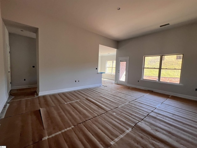 unfurnished room with light wood-type flooring